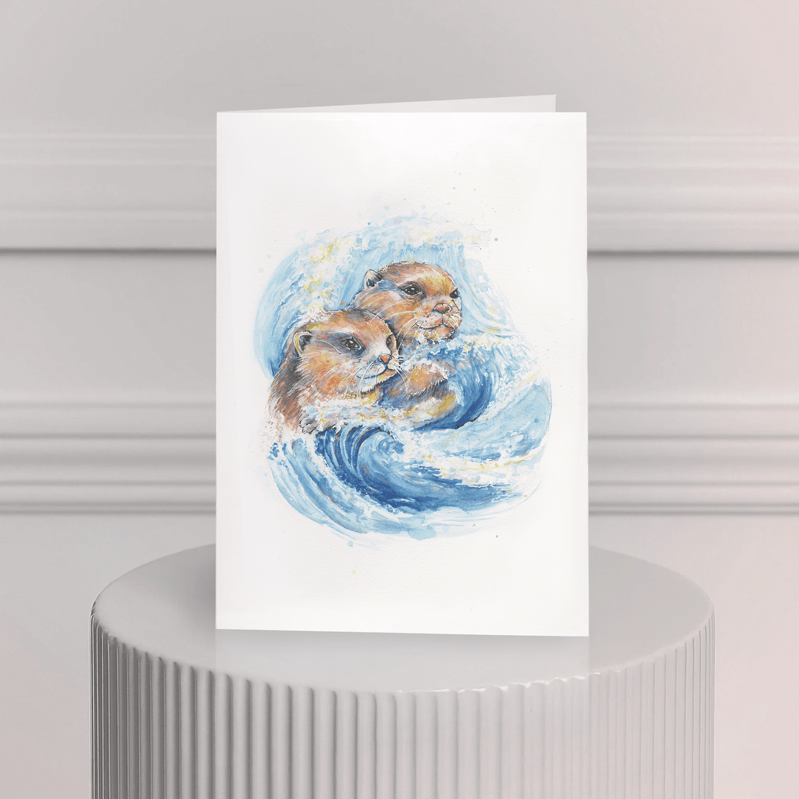 Carte de souhait aquarelle – deux loutres et vague